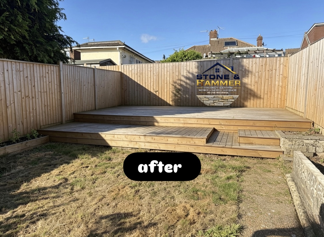 Back garden with new timber decking and fresh fence panels