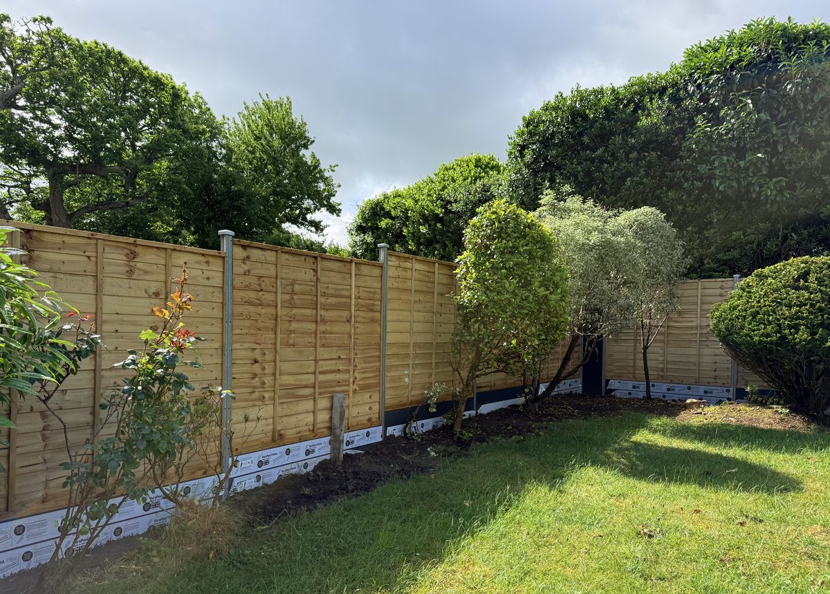 New wooden panel fence after installation