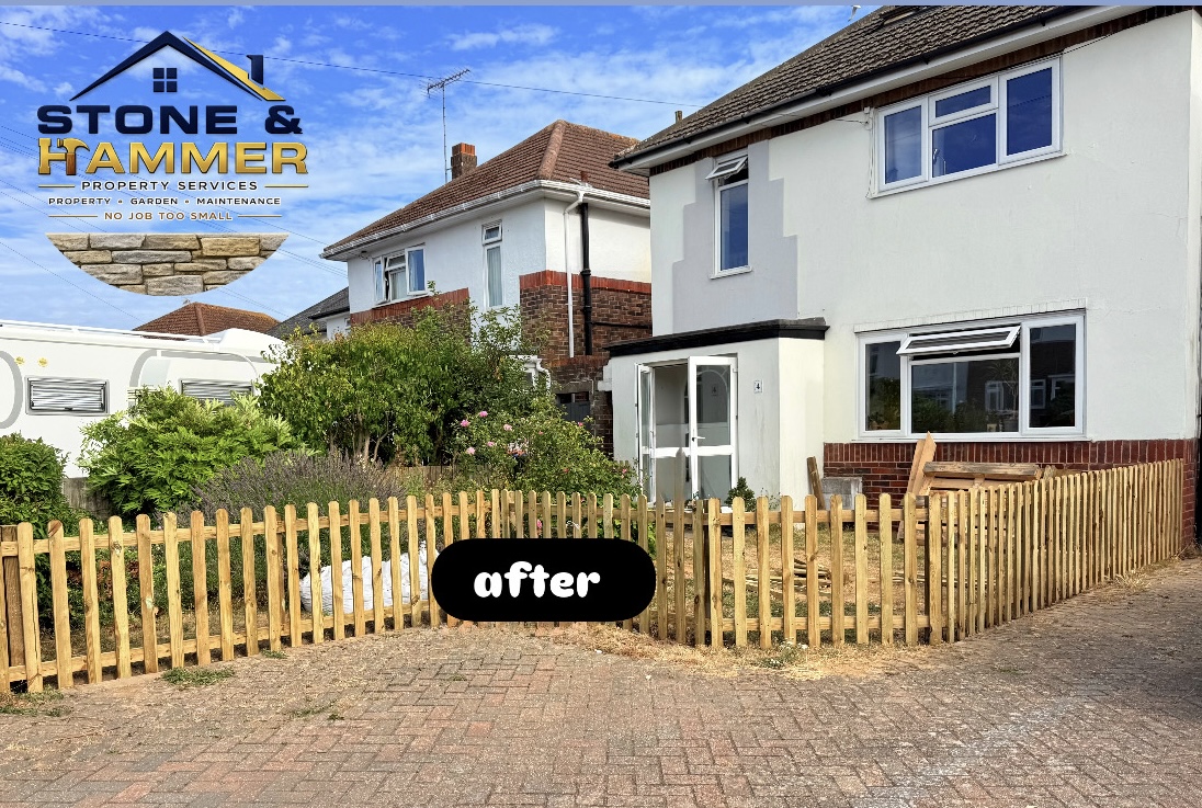 New wooden picket fence framing the front garden
